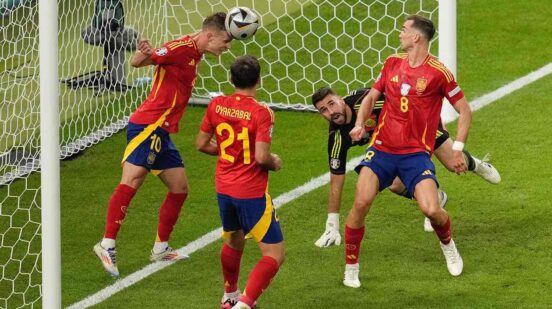 Spain's Dani Olmo clears the ball from the goal