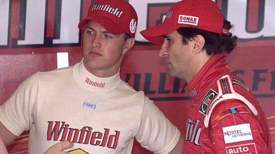 Italian Alessandro Zanardi (R) and his teammate German Ralf Schumacher