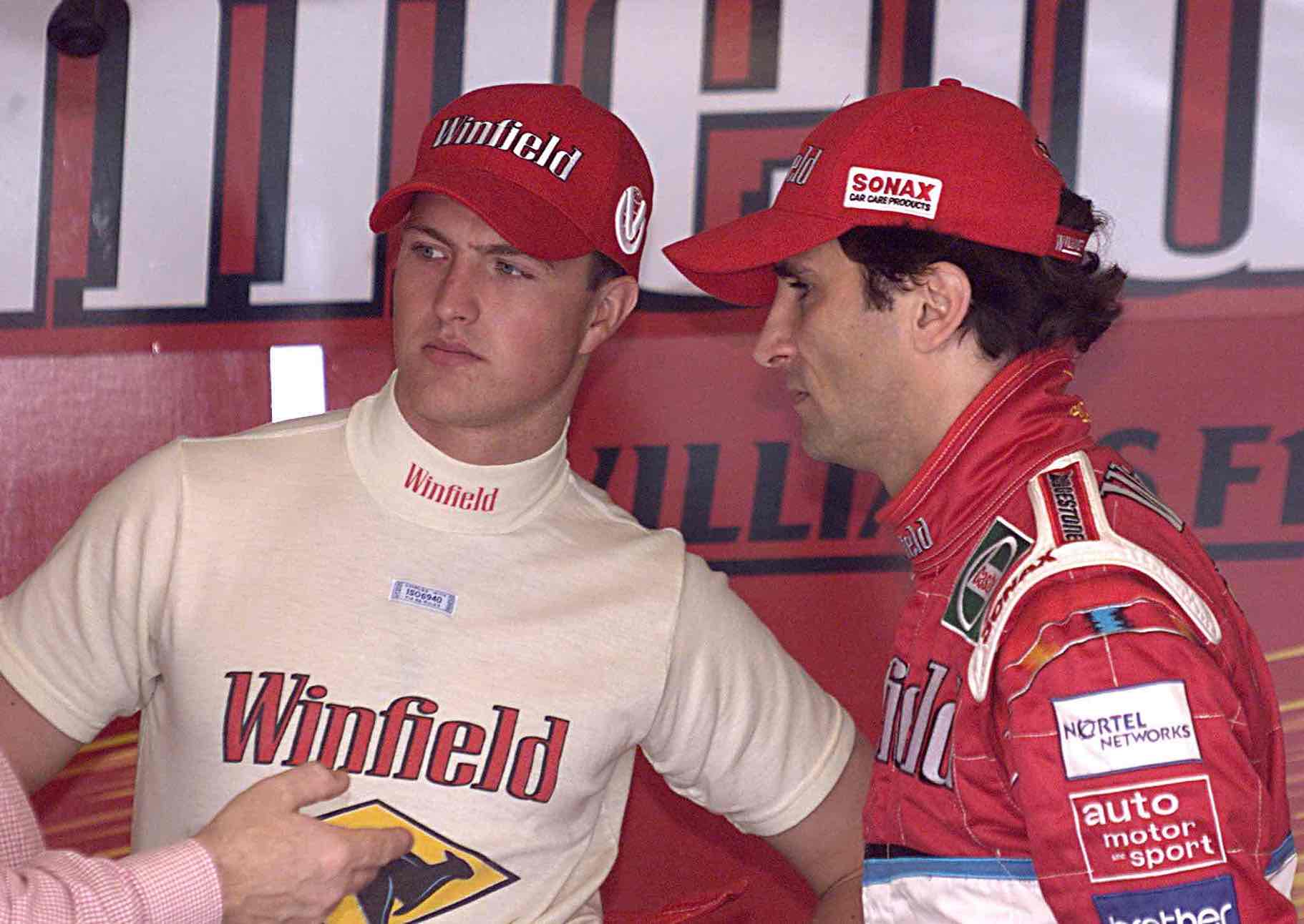 Italian Alessandro Zanardi (R) and his teammate German Ralf Schumacher