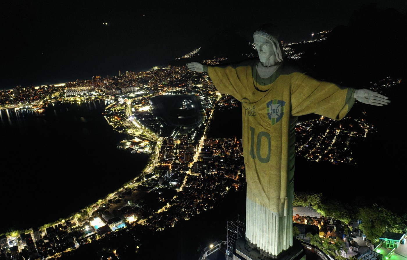 Aerial view showing an image projected onto the Christ the Redeemer statue pays tribute to Brazilian football legend Pele on the first anniversary of his death
