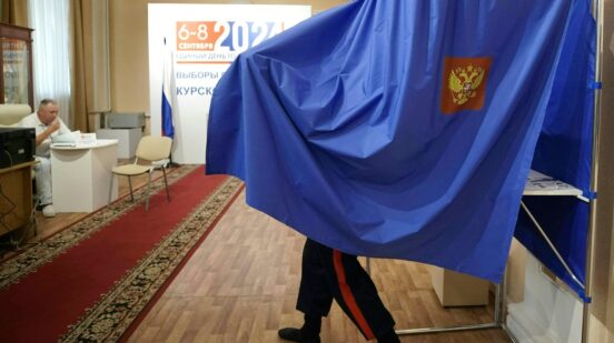 A man votes in Russia's regional elections