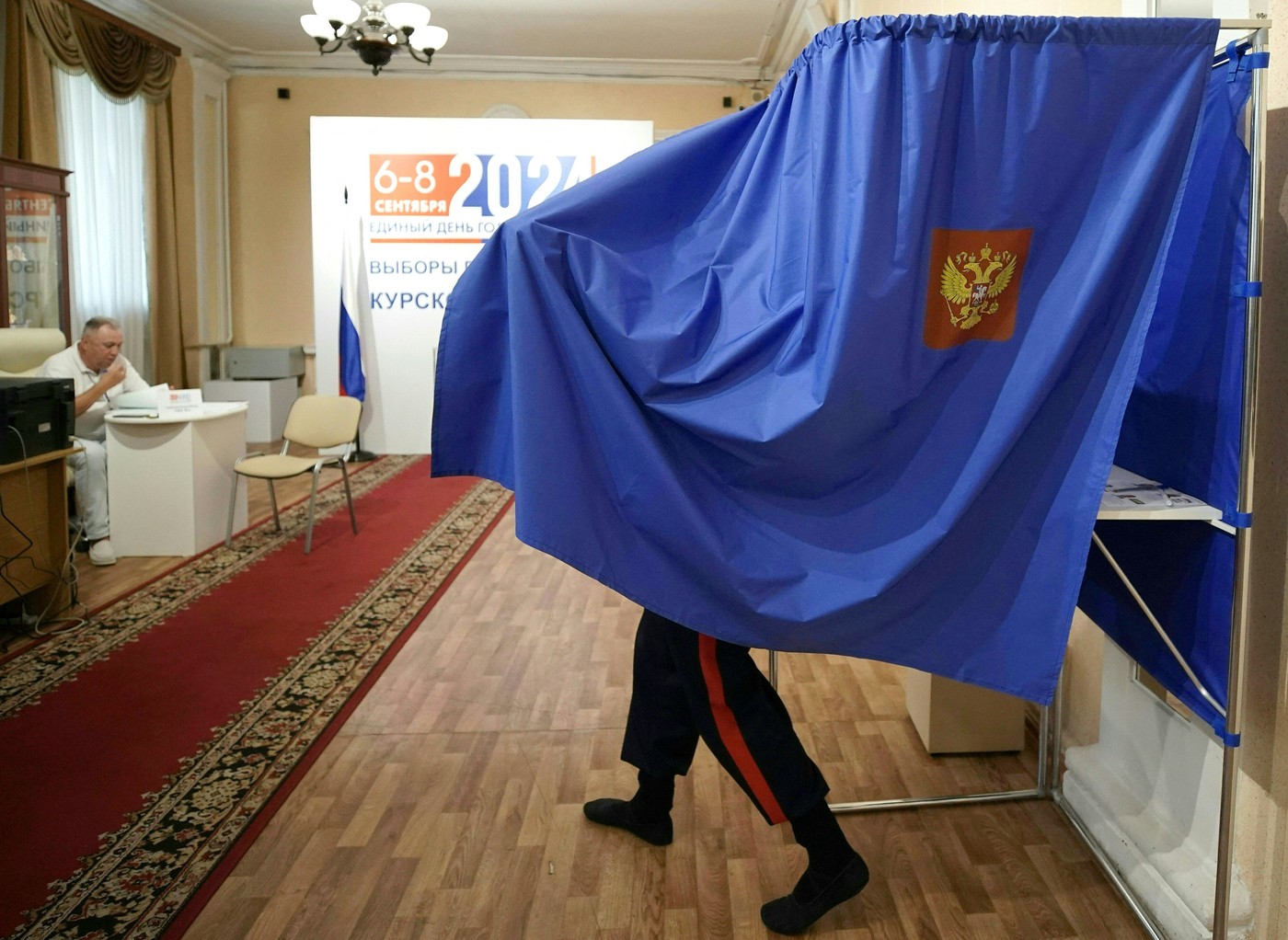 A man votes in Russia's regional elections