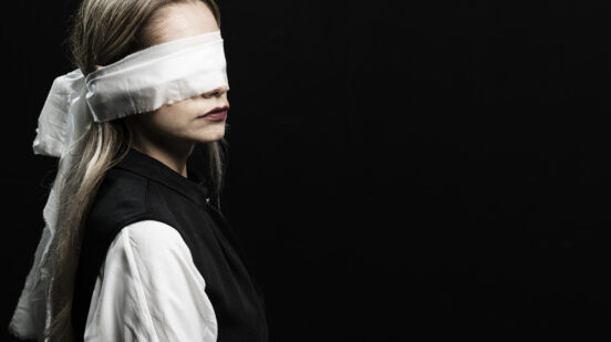 Woman with blindfold and copy space/ Femicid