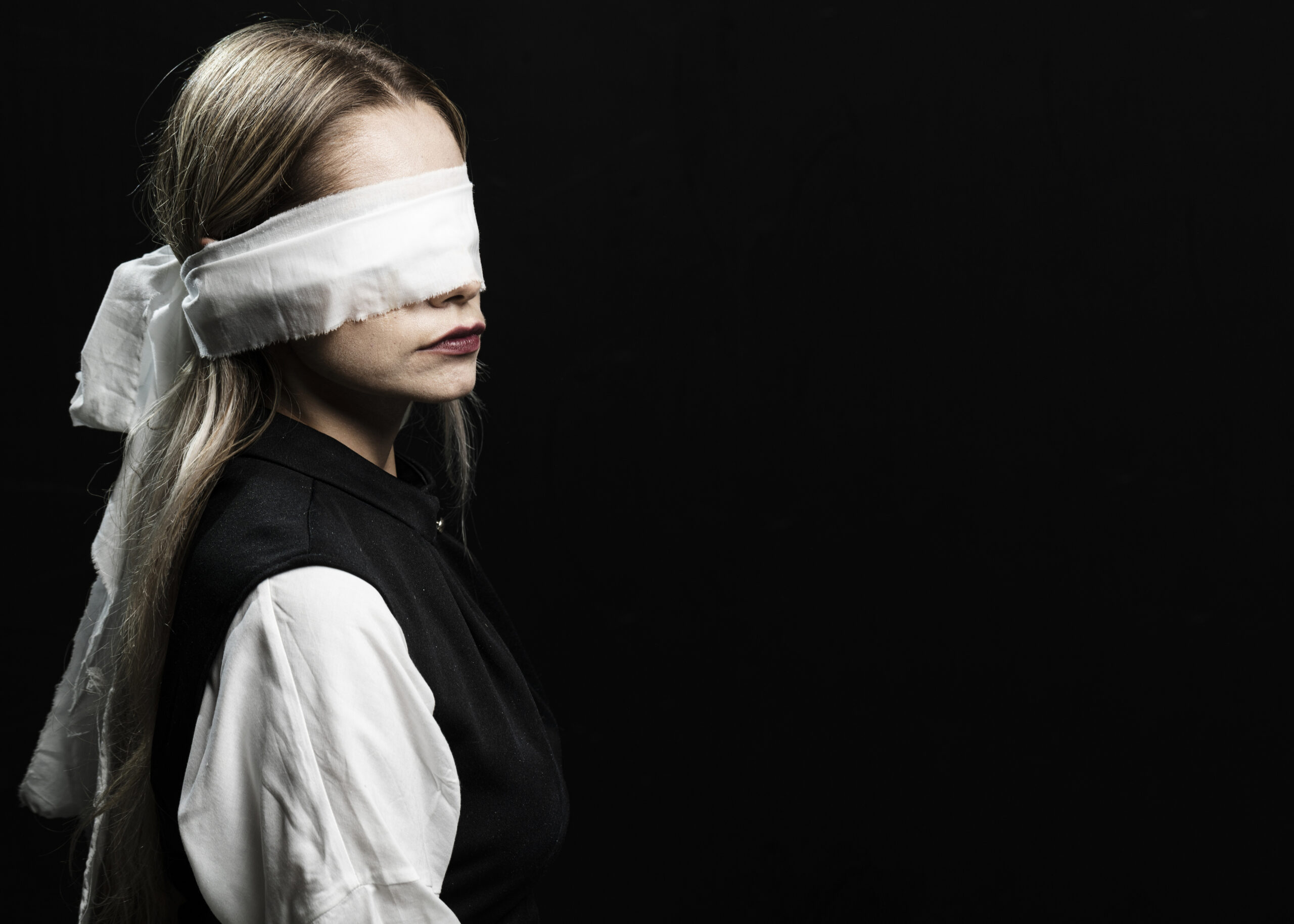 Woman with blindfold and copy space/ Femicid